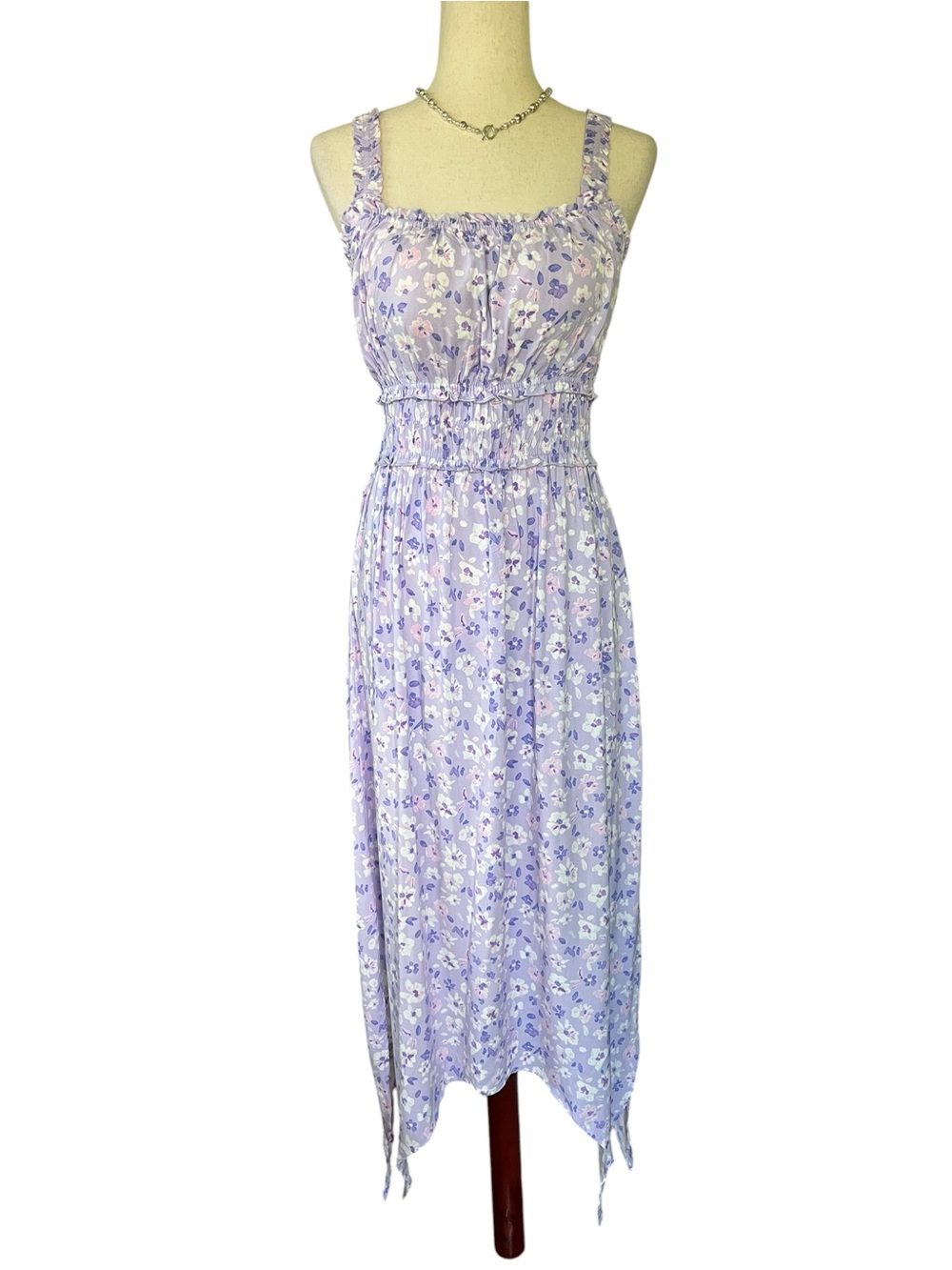 No Boundaries Juniors Sleeveless Hanky Hem Dress in a lavender floral pattern